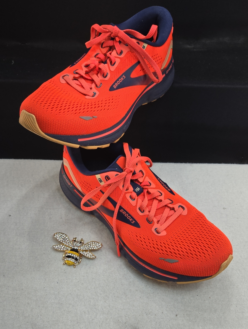 Brooks Ghost 15 Road-Running Shoes in Coral/Navy/Peach colorway. 120380-657